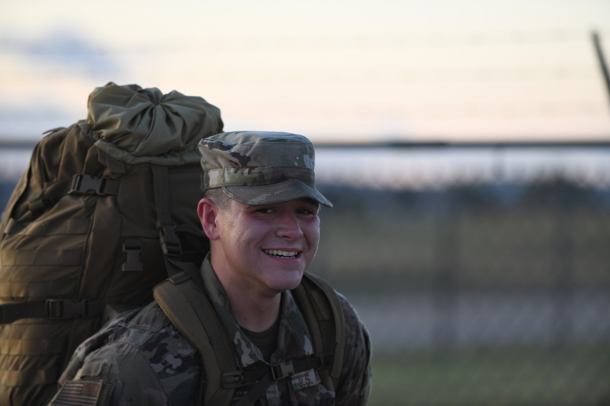 Airman 1st Class John Ennis, a 28th Bomb Wing Public Affairs broadcast journalist, carries a 33 pound rucksack as part of the German Armed Forces Proficiency test at Ellsworth Air Force Base, S.D., Sept. 21, 2019. Airmen tested alongside Army ROTC cadets and South Dakota Army National Guardsmen. Participants were required to complete six events in order to qualify for the coveted German Armed Forces Proficiency Badge. (U.S. Air Force Airman 1st Class Christina Bennett)