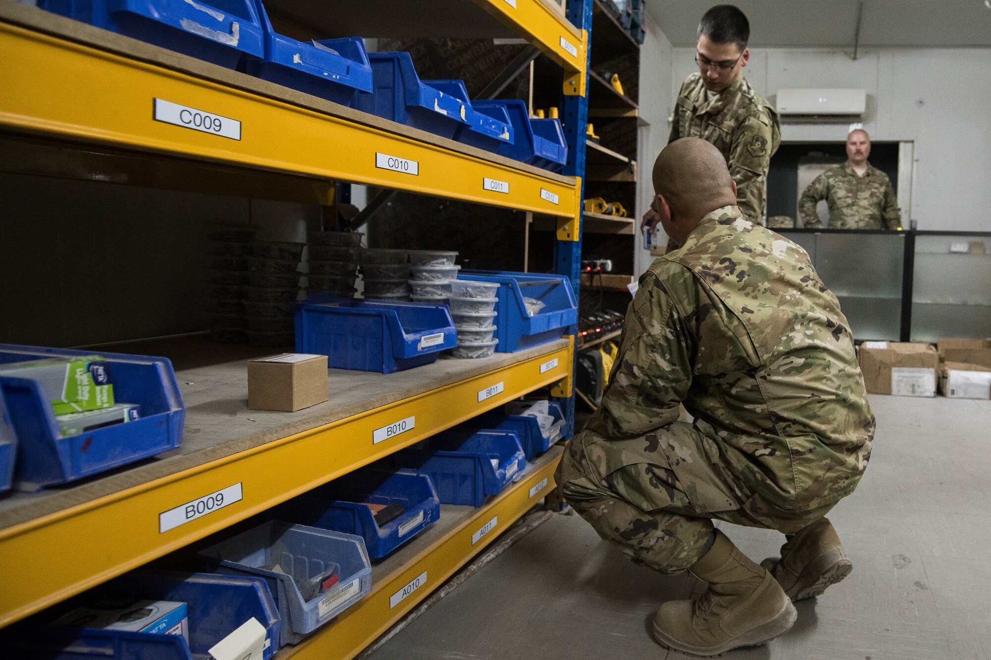 U-Fix-It employees from the 386th Expeditionary Civil Engineer Squadron look for items requrested from a customer at Ali Al Salem Air Base, Kuwait, Sept. 6, 2019. Craftsmen work with the unit resource advisor, talk to outside vendors and submit all requirements gathered to the contracting officer for approval through finance. (U.S. Air Force photo by Senior Airman Lane T. Plummer)