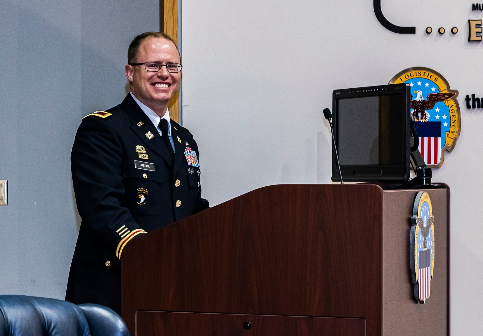 Man speaking at a podium.