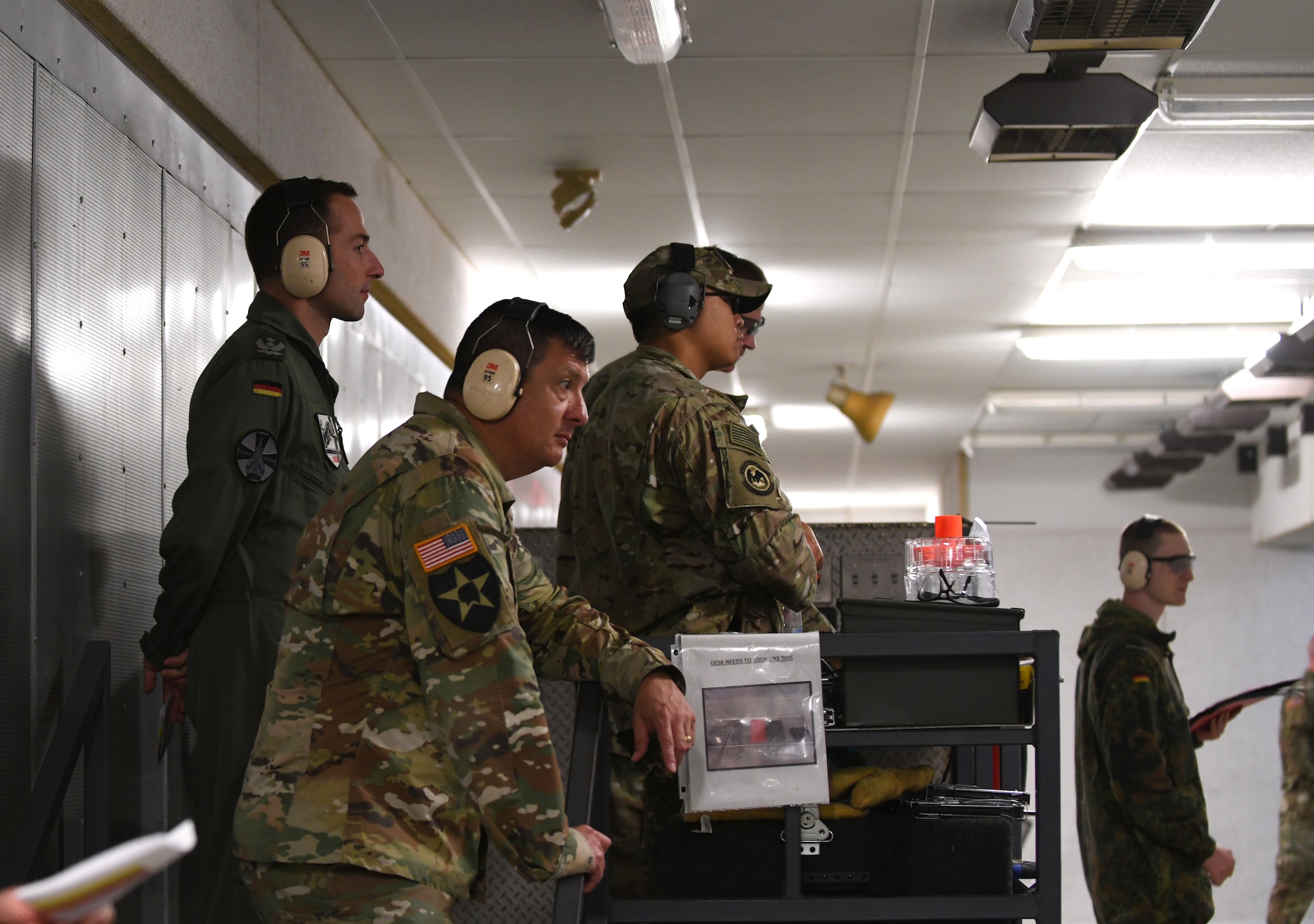Lt. Col. Elvis Coronado, the South Dakota School of Mines and Technology military department chair, stands alongside a German officer at the Combat Arms and Maintenance facility at Ellsworth Air Force Base, S.D., Sept. 21, 2019. Eleven Ellsworth Airmen participated in the German Armed Forces Proficiency Test alongside South Dakota Army National Guardsmen and Army ROTC cadets. Participants had to complete six events in order to qualify for the coveted German Armed Forces Proficiency Badge. (U.S. Air Force photo by Airman 1st Class Christina Bennett)