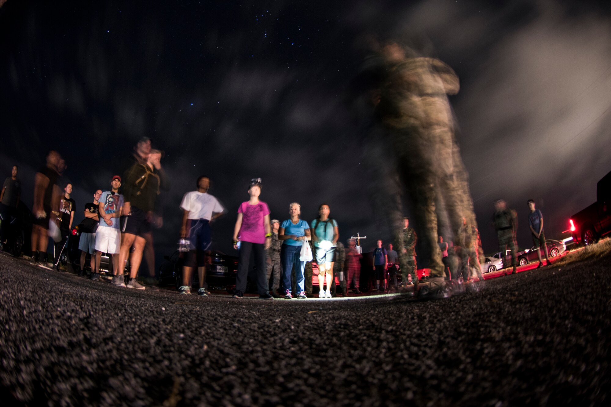 47th Flying Training Wing Command Chief Master Sgt. Robert Zackery III talks to a crowd of Airmen before beginning the 5-kilometer “Walk with the Chief” ruck at Laughlin Air Force Base, Texas, Sept. 30, 2019. Approximately 30 members of Team XL came out in the early hours on Monday morning to increase their deployment readiness and have an opportunity to connect with Zackery in an informal setting. (U.S. Air Force photo by Senior Airman Marco A. Gomez)