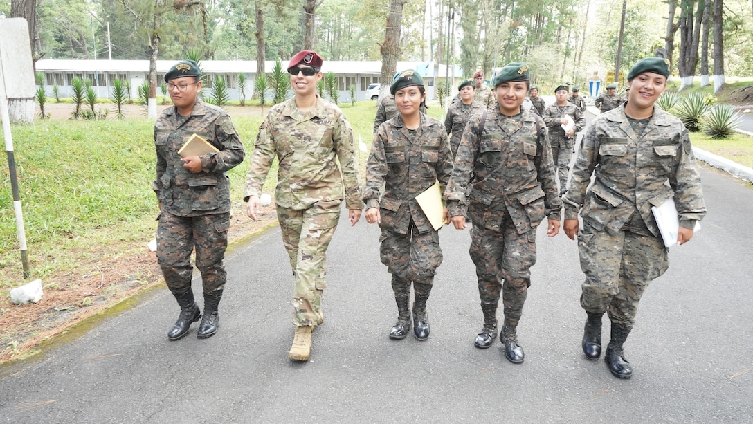 A group of Guatemalan military women walk together.