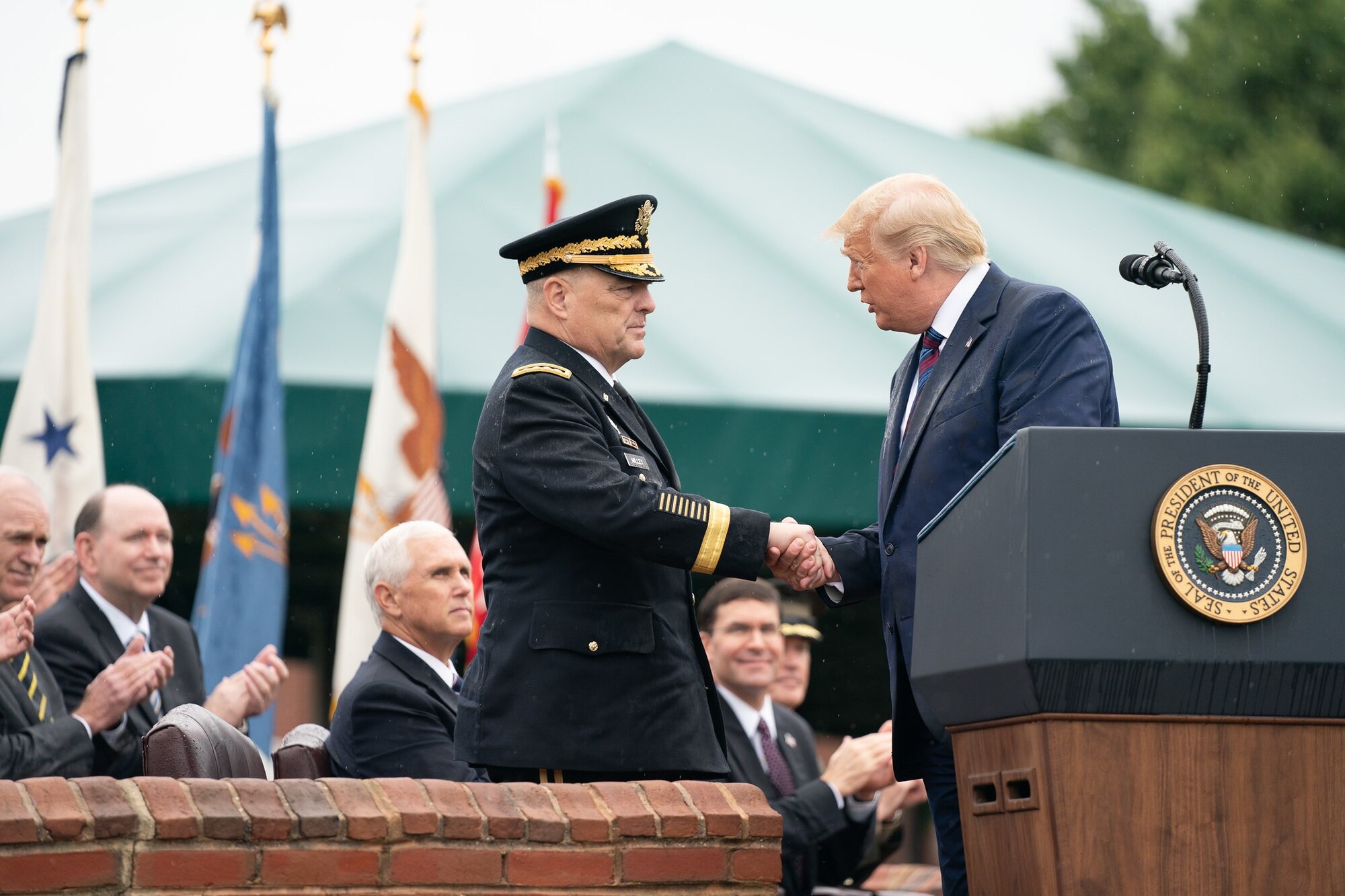 President Donald J. Trump shakes hands with Army Gen. Mark A. Milley upon the latter’s assumption of office as the 20th chairman of the Joint Chiefs of Staff during a ceremony at Joint Base Myer-Henderson Hall, Virginia, Sept. 30, 2019.