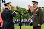 Marine Corps Gen. Joe Dunford, the outgoing chairman of the Joint Chiefs of Staff, swears in his successor, Army Gen. Mark A. Milley, during an armed forces welcome ceremony at Joint Base Myer-Henderson Hall, Virginia, Sept. 30, 2019.