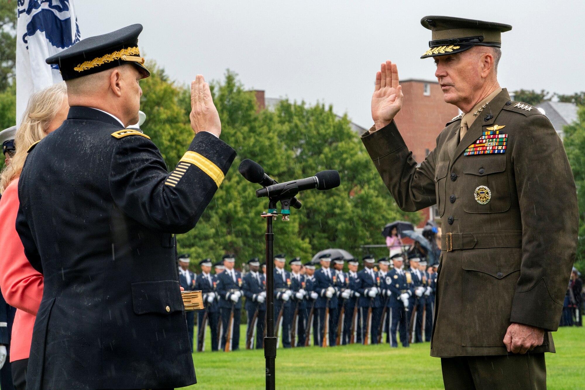 Marine Corps Gen. Joe Dunford, the outgoing chairman of the Joint Chiefs of Staff, swears in his successor, Army Gen. Mark A. Milley, during an armed forces welcome ceremony at Joint Base Myer-Henderson Hall, Virginia, Sept. 30, 2019.