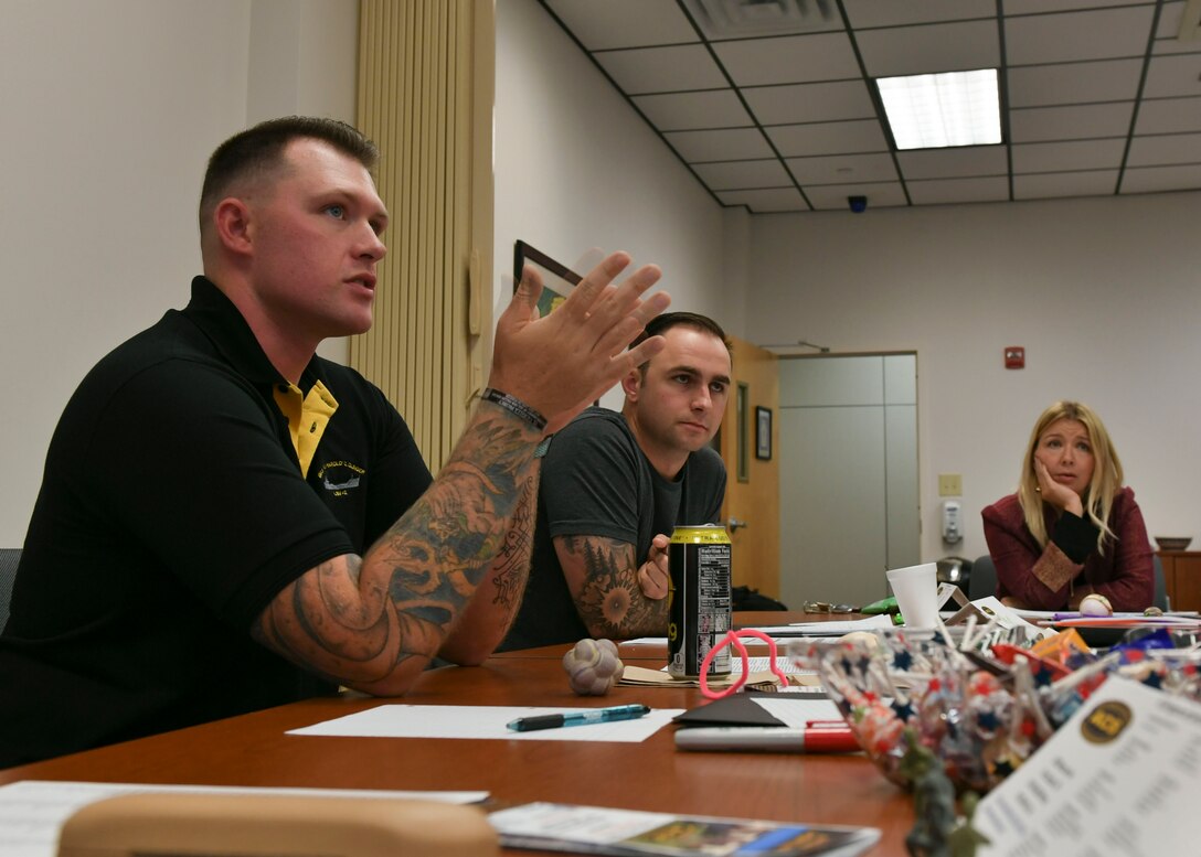 U.S. Army Sgt. Ashton Van Roekel, 73rd Transportation Company, 10th Transportation Battalion, 7th Transportation Brigade (Expeditionary) watercraft operator (left) discusses community concerns during the Army Family Action Plan conference at Joint Base Langley-Eustis, Virginia, Sept. 24-26, 2019.