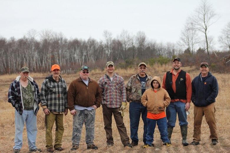 Seven volunteers and a USACE Philadelphia District team member pose for a photo at an outdoor location on the property of the Francis E. Walter Dam. The group worked to restore a section of a borrow area by removing invasive species and planting native and pollinator plant species that enhance wildlife habitat.