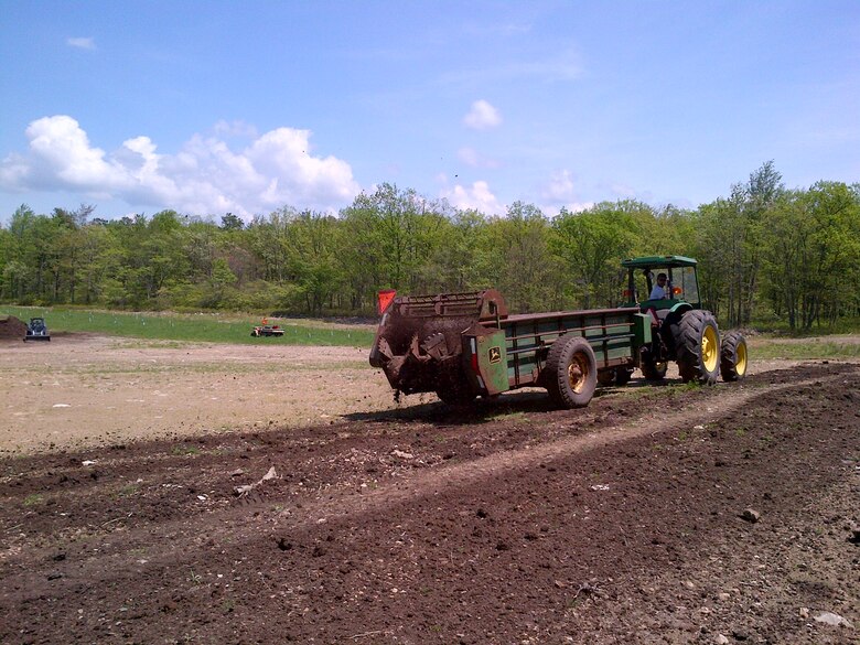 A manure spreader was used to spread topsoil at the Francis E. Walter Dam as part of environmental restoration efforts. For the past 11 years, the Army Corps and partners have worked to restore areas that were excavated during the construction of the dam more than 60 years ago. Partners have removed invasive species and planted native and pollinator plant species that enhance wildlife habitat.