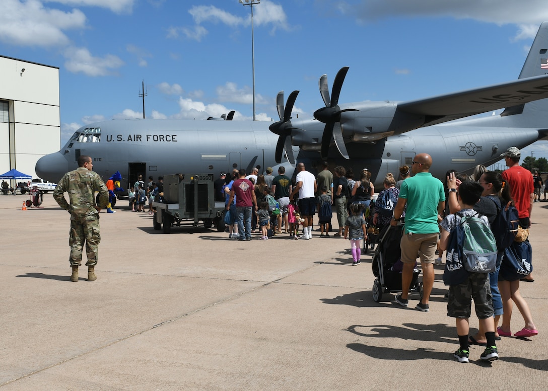 Families wait to board a C-130J Super Hercules aircraft during Operation Dyess Kids at Dyess Air Force Base, Texas, Sept. 28, 2019.