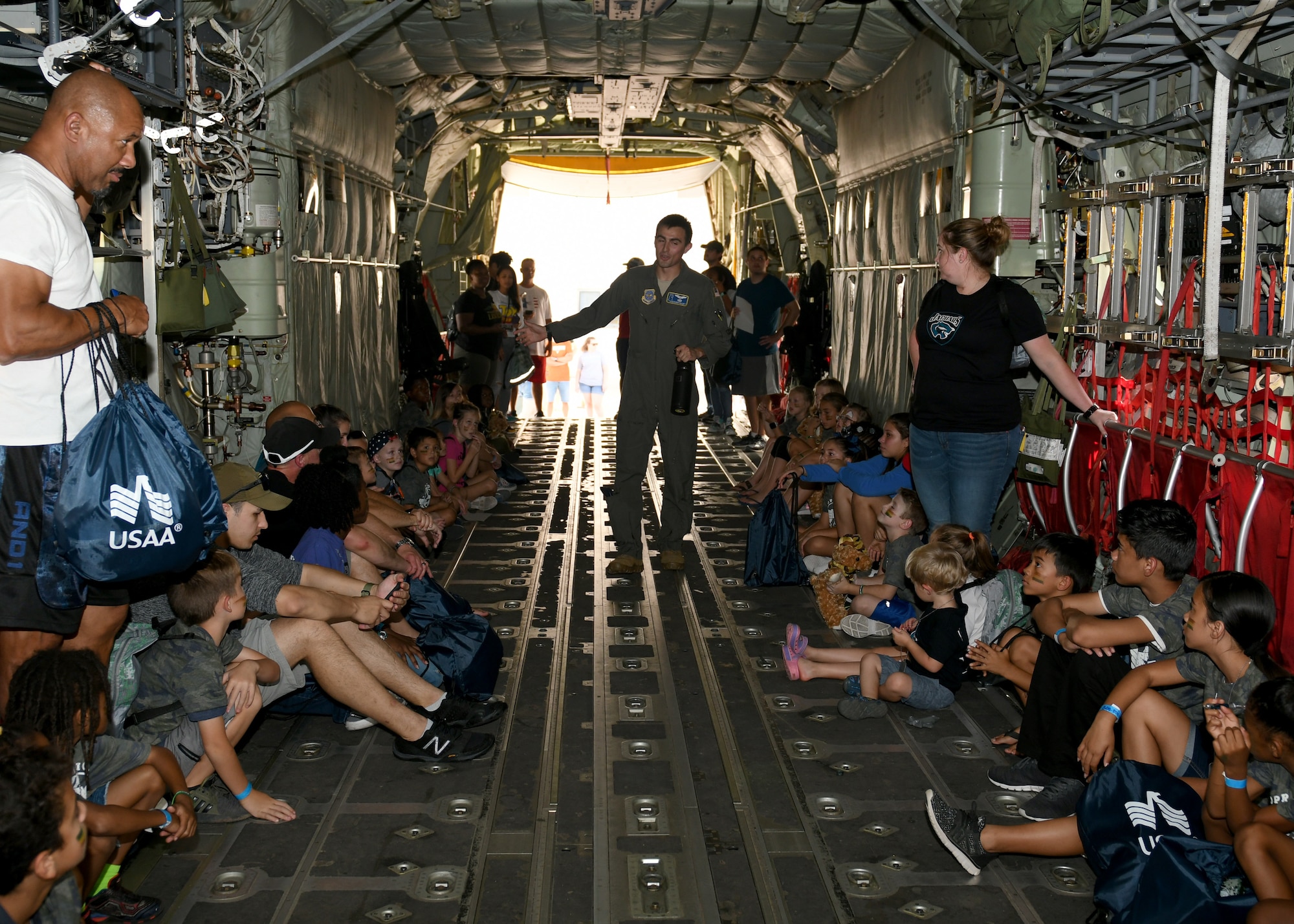 1st Lt. Alexander Bollwitt, 40th Airlift Squadron C-130J Super Hercules pilot, middle, briefs children on their mission during Operation Dyess Kids on Dyess Air Force Base, Texas, Sept. 28, 2019.