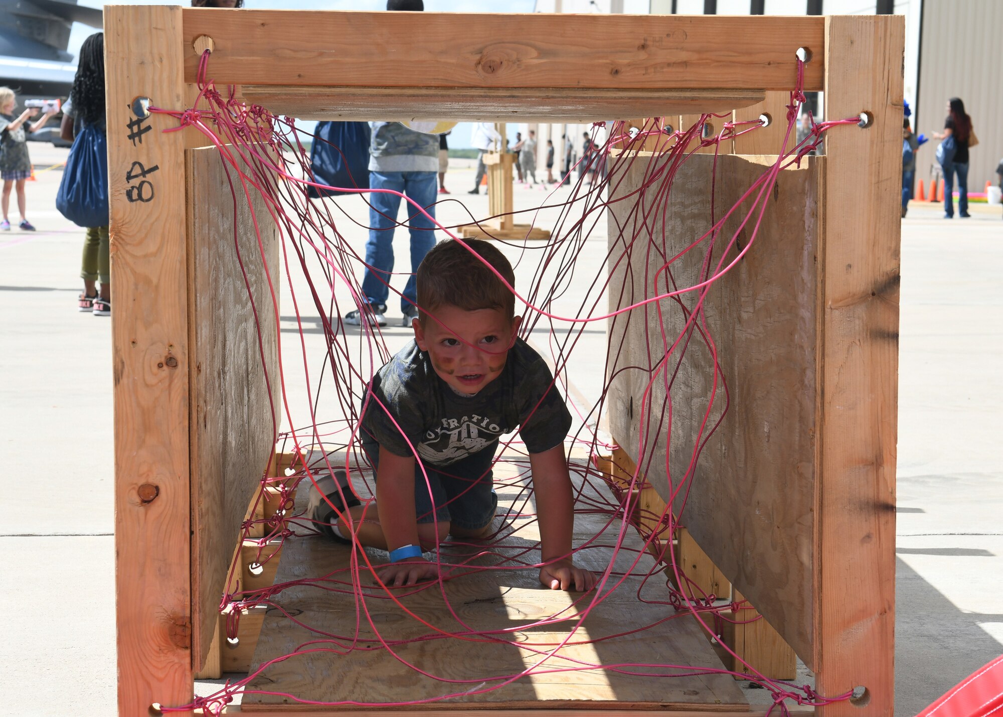 Rhett Griffin, son of Airman 1st Class Benjamin Griffin, 317th Aircraft Maintenance Squadron C-130J Super Hercules crew chief, crawls through an obstacle course during Operation Dyess Kids at Dyess Air Force Base, Texas, Sept. 28, 2019.