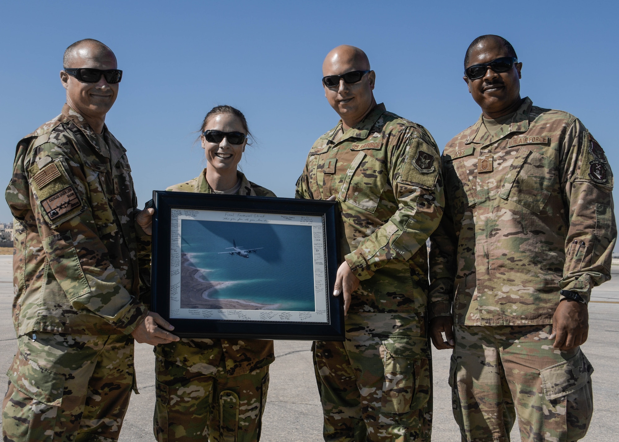 Chief Master Sgt. Marvin Jones is presented a signed photograph from all Dobbins Air Reserve Base Airmen who participated in Exercise Eager Lion in Jordan on Sept. 6, 2019. Eager Lion is a multi-national exercise where Dobbins is the primary provider of air support. (U.S. Air Force photo by Senior Airman Josh Kincaid)