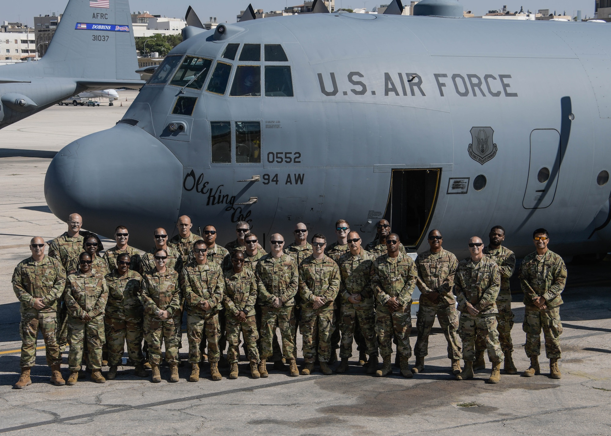 Airmen from Dobbins Air Reserve Base, Georgia, pose for a picture in front of a C-130H on the last day of Exercise Eager Lion in Jordan on Sept. 6, 2019. Eager Lion is a multi-national exercise where Dobbins Air Reserve Base is the primary provider of air support. (U.S. Air Force photo by Senior Airman Josh Kincaid)