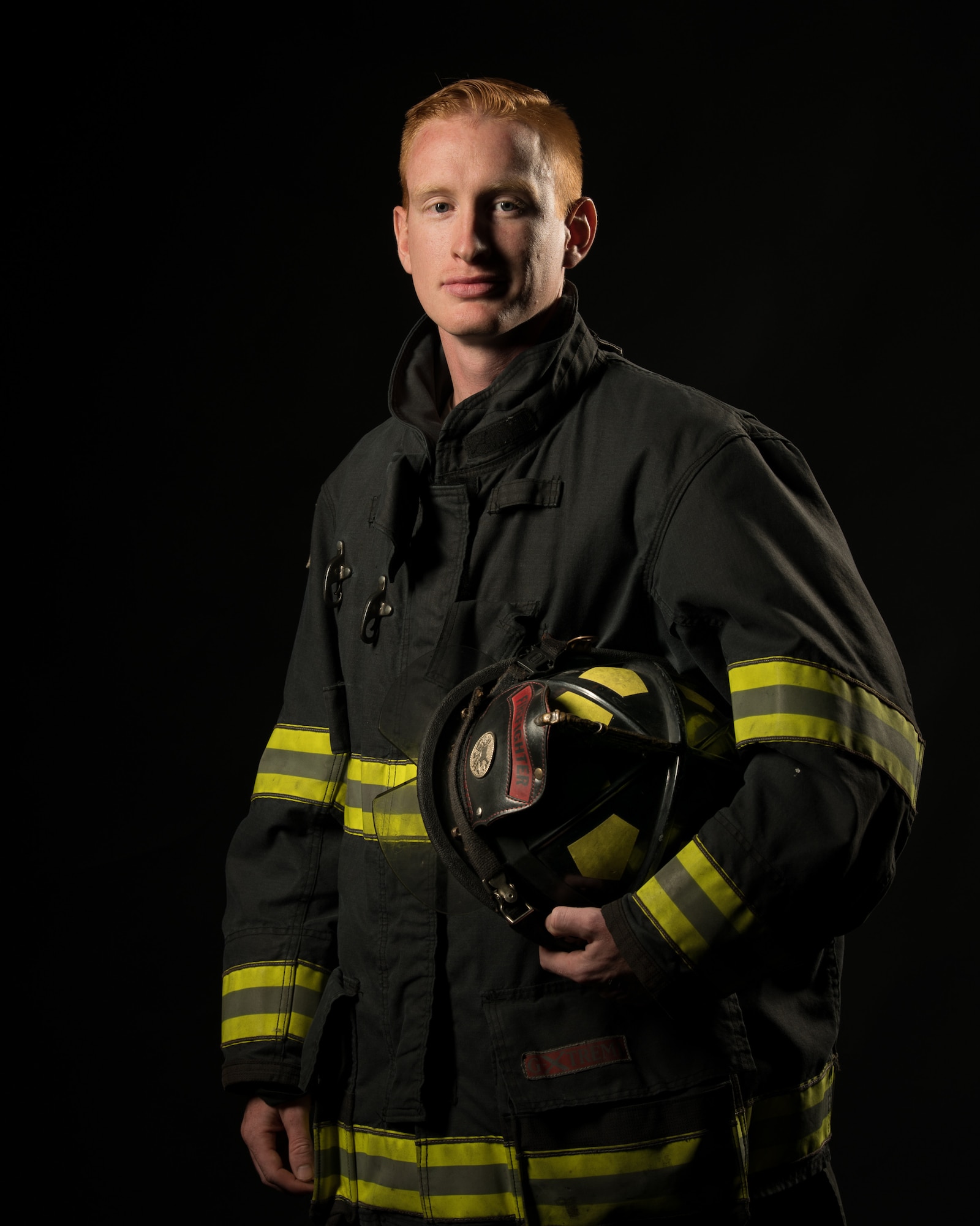 Senior Airman Patrick Erwin, 436th Civil Engineer Squadron driver operator, poses for Fire Prevention Week Oct. 1, 2019, at Dover Air Force Base, Del. During Fire Prevention Week, the Dover AFB Fire Department hosts various activities in order to raise fire safety awareness for Airmen and their families. (U.S. Air Force photo by Mauricio Campino)