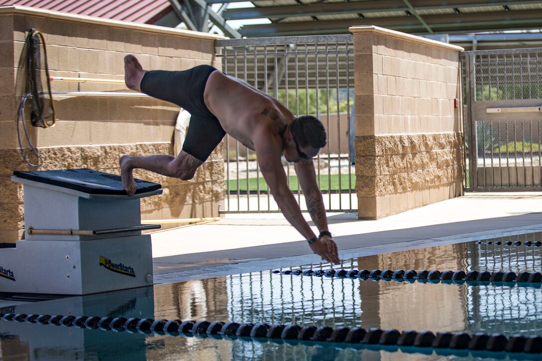 U.S. Marine Staff Sgt. Jason Pacheco, a recovering service member with Wounded Warrior Battalion - West,Wounded Warrior Regiment, dives into the pool at the Hope and Care Center on Marine Corps Base Camp Pendleton, California, Sept. 4, 2019. In 2010, Pacheco was wounded by an improvised explosive device in Marjah, Afghanistan, resulting in the loss of his right leg and damage to the left. Pacheco redeployed to Afghanistan with his unit in 2012, becoming one of the few amputees to be deployed to a combat zone. In 2018, he competed in the Department of Defense Warrior Games, competing in swimming, shooting, archery, wheelchair basketball, and sitting volleyball. Pacheco was also named the Camp Pendleton Male Athlete of the Year for the same year.