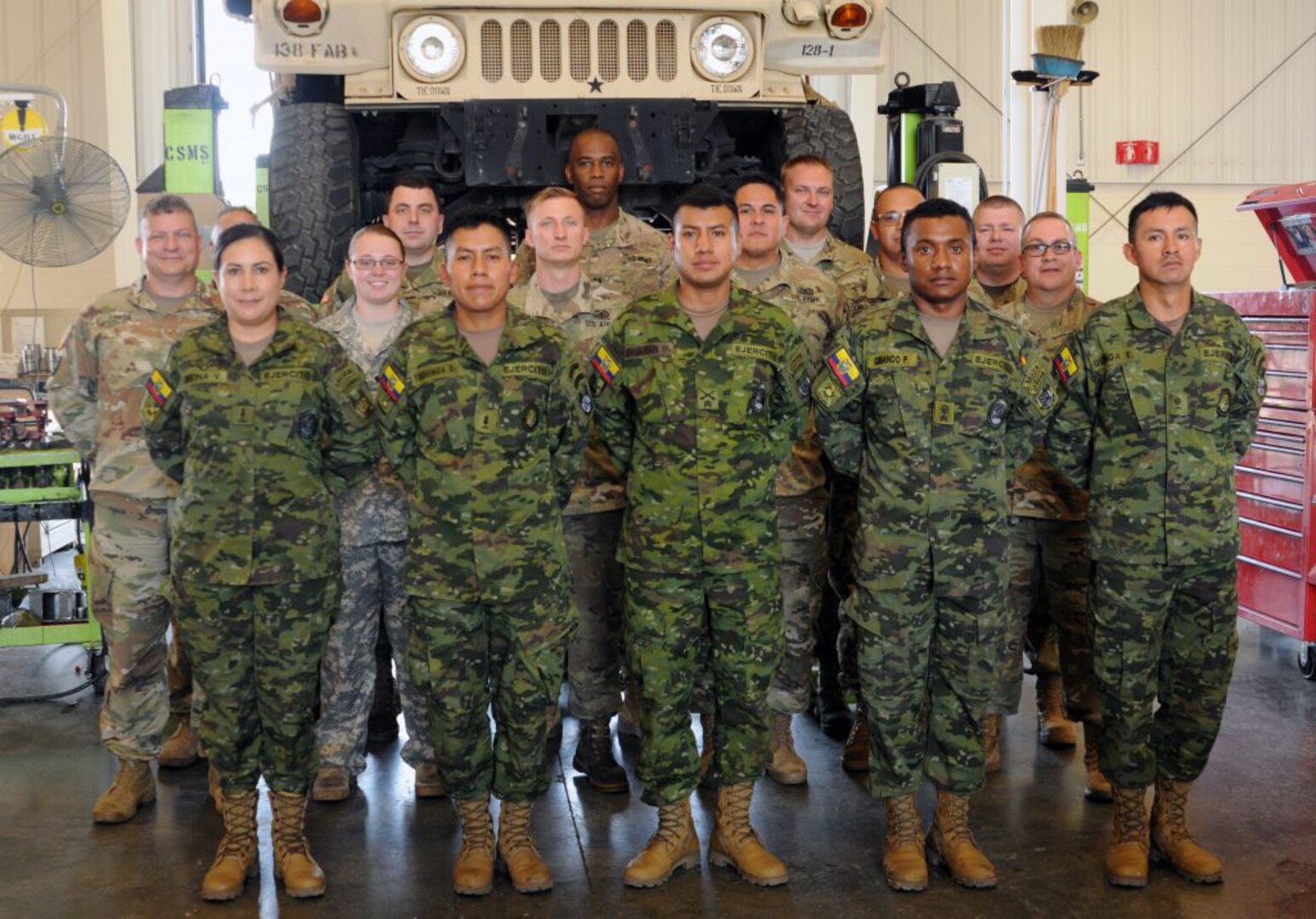 Soldiers gather for a photo during training with Ecuadorian soldiers as part of the State Partnership Program at the Combined Support Maintenance Shop in Richmond, Ky., Sept. 18, 2019.