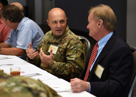 U.S. Air Force Lt. Col. Christopher Sharp, 316th Training Squadron commander, speaks with an Honorary Commander during the Honorary Commanders Luncheon at the event center on Goodfellow Air Force Base, Texas, September 27, 2019. Honorary commanders are selected based on their level of community involvement and their reach in the community. (U.S. Air Force photo by Airman 1st Class Robyn Hunsinger/Released)