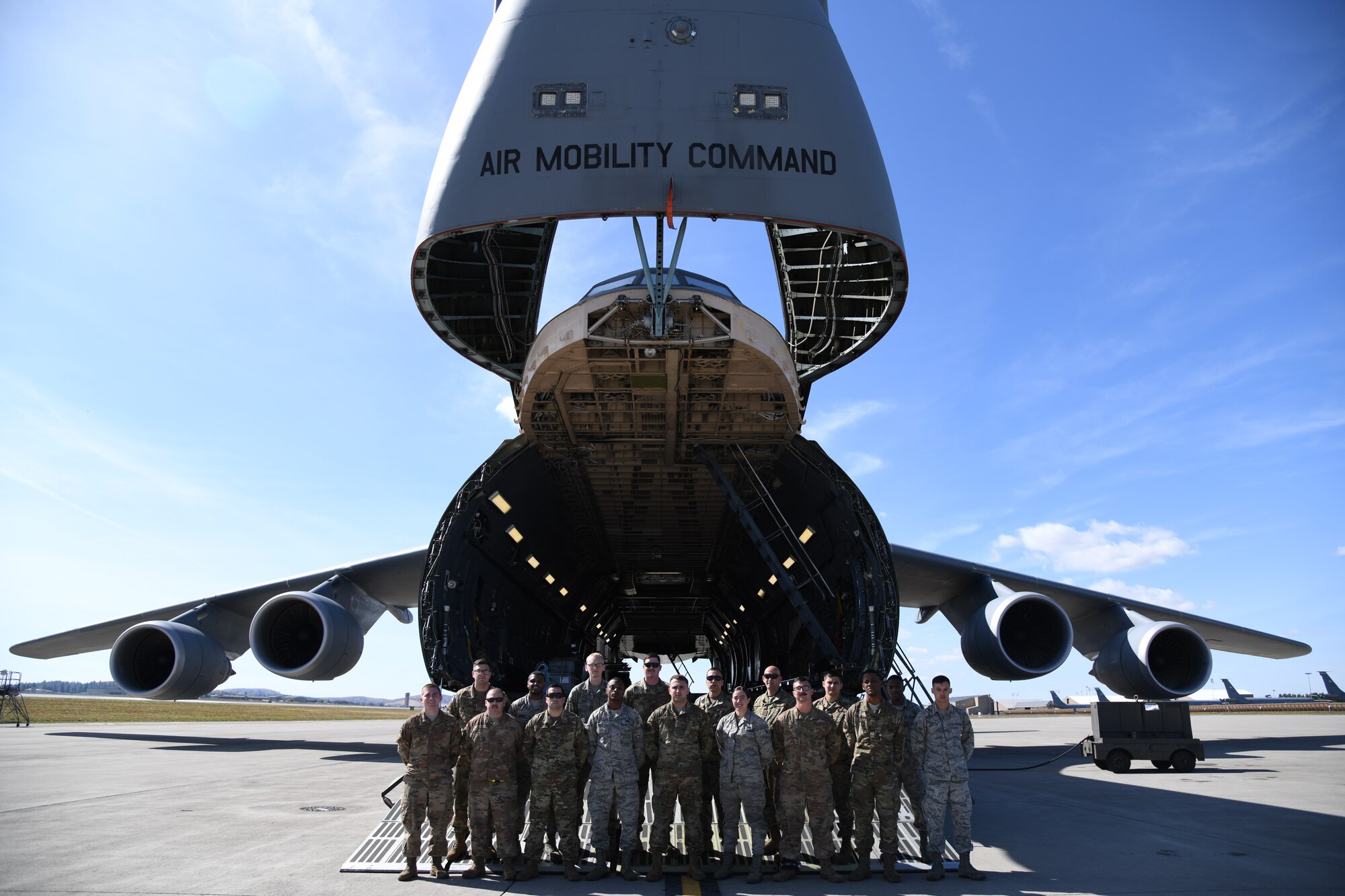 Airmen from the 436th Maintenance Squadron and 436th Aircraft Maintenance Squadron pose for a photo on the forward ramp of a C-5M Super Galaxy, Sept. 24, 2019, at Fairchild AFB, Wash., during Mobility Guardian 2019. Exercise Mobility Guardian is Air Mobility Command's premier large-scale mobility exercise. Through robust and relevant training, Mobility Guardian improves the readiness and capabilities of Mobility Airmen to deliver rapid global mobility and builds a more lethal and ready Air Force.(U.S. Air Force photo by TSgt Esteban Esquivel).