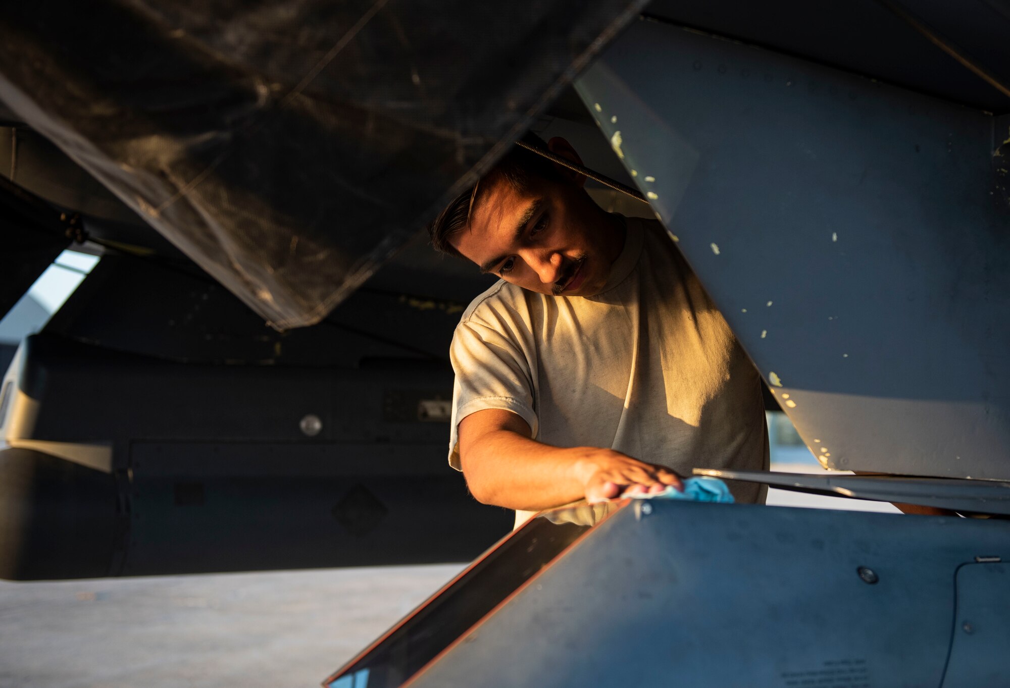 Airman 1st Class Bonifacio Garcia, 757th Aircraft Maintenance Squadron tactical aircraft maintainer, cleans an F-15E Strike Eagle fighter jet during Combat Archer 19-12 on Tyndall Air Force Base, Fla., Sept. 24, 2019. Combat Archer is the Department of Defense’s largest air-to-air live fire missile employment exercise. (U.S. Air Force photo by Airman 1st Class Bailee A. Darbasie)