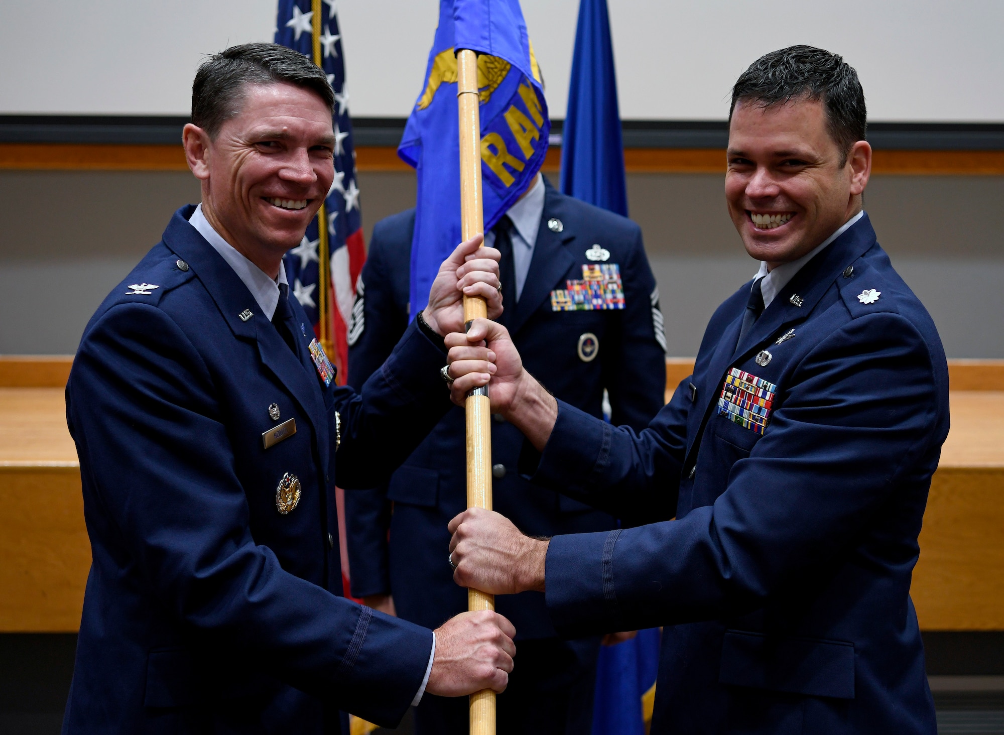 Lt. Col. Peter Francik (right) accepts the guidon and command of the 318th Range Squadron from Col. James Hewitt, 318th Cyberspace Operations Group commander, during the squadron’s activation ceremony at Joint Base San Antonio-Lackland, Texas, Oct. 1, 2019. The then-614th Radar Squadron was previously inactivated Aug. 1, 1963, at Cherry Point Marine Corps Air Station, N.C. (U.S. Air Force photo by Tech. Sgt. R.J. Biermann)