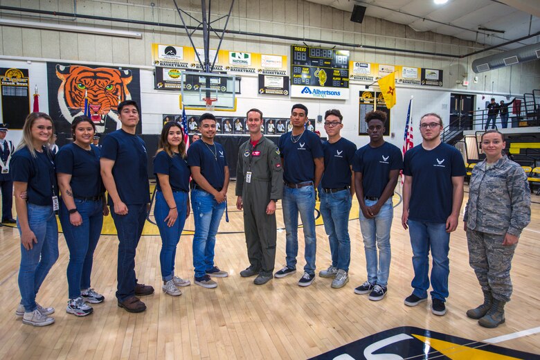 Lt. Col. Ryan Typolt (center), 29th Attack Squadron commander, poses with the Alamogordo Delayed Entry Program enlistees and Master Sgt. Kimberly Ransom, 367th Recruiting Squadron recruiter, Sept. 27th, 2019, in Alamogordo, N.M. The DEP is the initial step for recruits while waiting for a basic training date. (U.S. Air Force photo by Staff Sgt. Christine Groening)