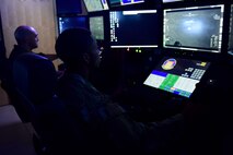 Remotely Piloted Aircraft aircrew fly simulated missions in an MQ-9 Reaper cockpit at Creech Air Force Base, Nevada, Sept. 4, 2019. The RPA mission is supported by Airmen in a variety of roles, including intelligence analysts, air traffic controllers and maintenance professionals. (U.S. Air Force photo by Senior Airman Haley Stevens)