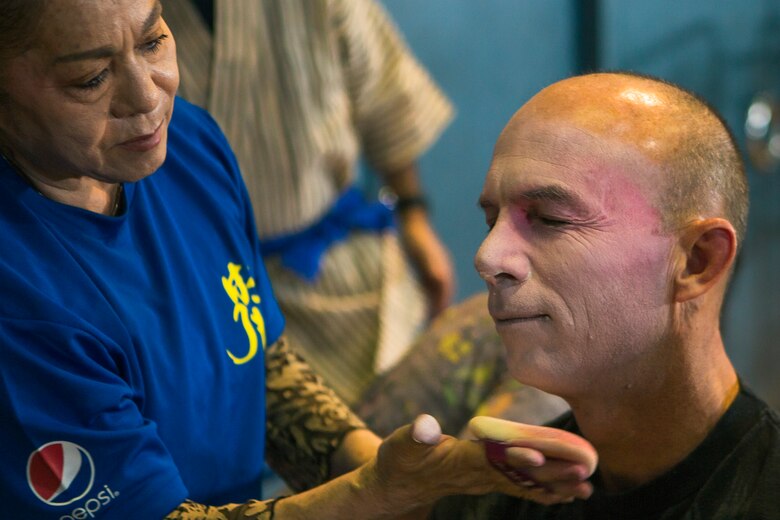 U.S. Marine Corps Col. David Steele, commander, Marine Corps Air Station Futenma, wears traditional makeup for participating in the 2019 Ginowan Hagoromo Festival Kanchashii dance competition, Sep. 29, 2019.