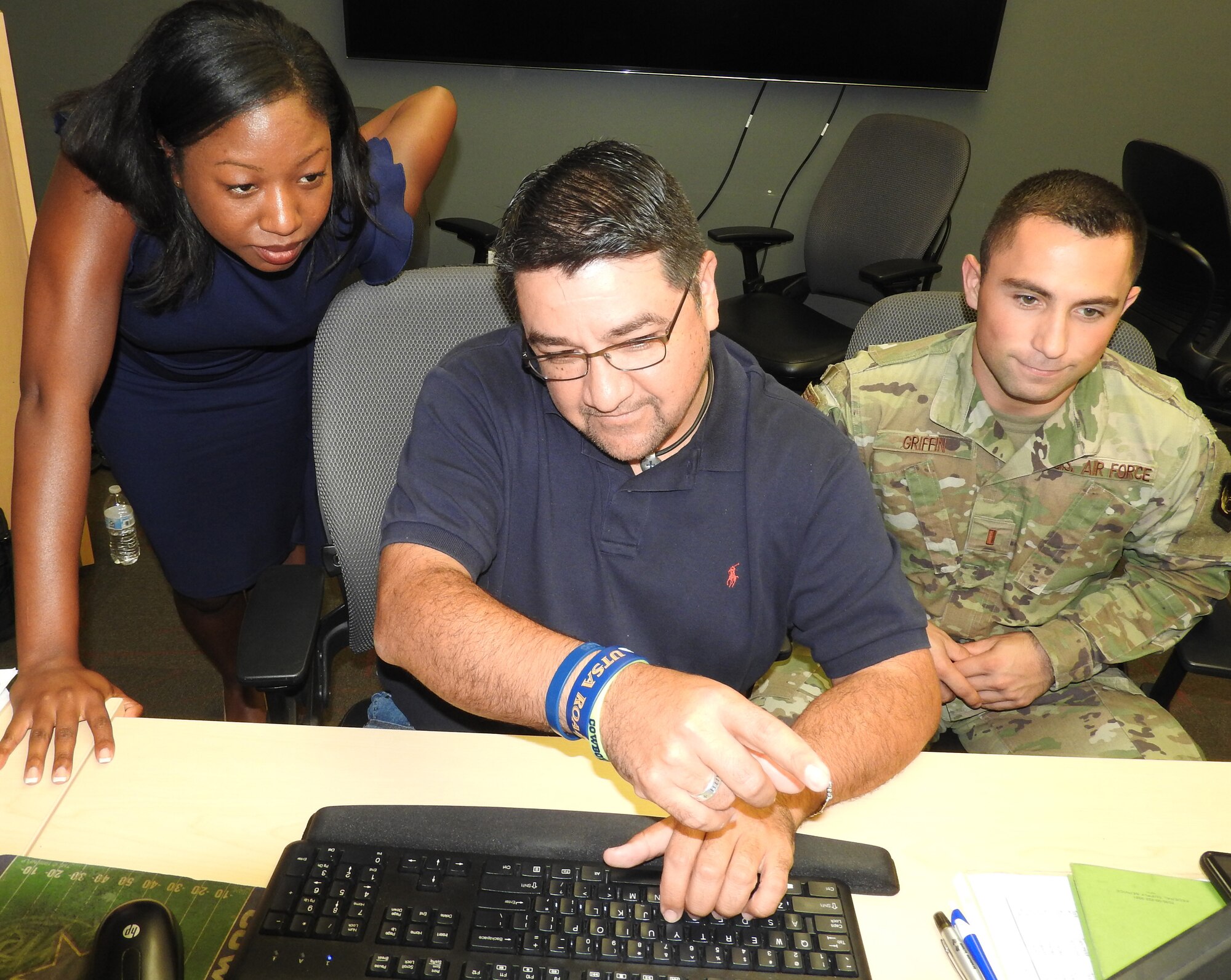 As 30 budget analysts and financial experts gathered at AFIMSC headquarters to close out the fiscal year, 2nd Lt. Paul Griffin and Emerald Lundy, budget officers from Hanscom AFB, Mass., received a behind the scenes look at AFIMSC and end of year operations from Felix Saenz, AFIMSC budget analyst. "This opportunity is powerful," said Chris Underwood, technical director for financial analysis with AFIMSC's budget office. "They are returning to their installation with more tools in their toolbox than when they arrived." (Air Force photo by Ed Shannon)