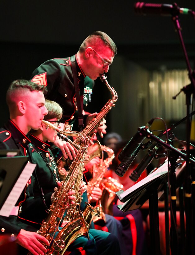 A Marine Corps musician with the Marine Corps Jazz Orchestra performs a saxophone solo at the University of North Texas in Denton, Texas, on Sept. 25, 2019. The performance helps highlight the talents of Marine musicians while building ties with the music community. (U.S. Marine Corps photo by Cpl. Desmond Andrews).