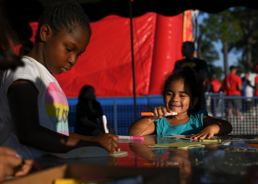 Children color under the arts and crafts tent at an Oktoberfest celebration at Joint Base Langley-Eustis, Virginia, Sept. 27, 2019.