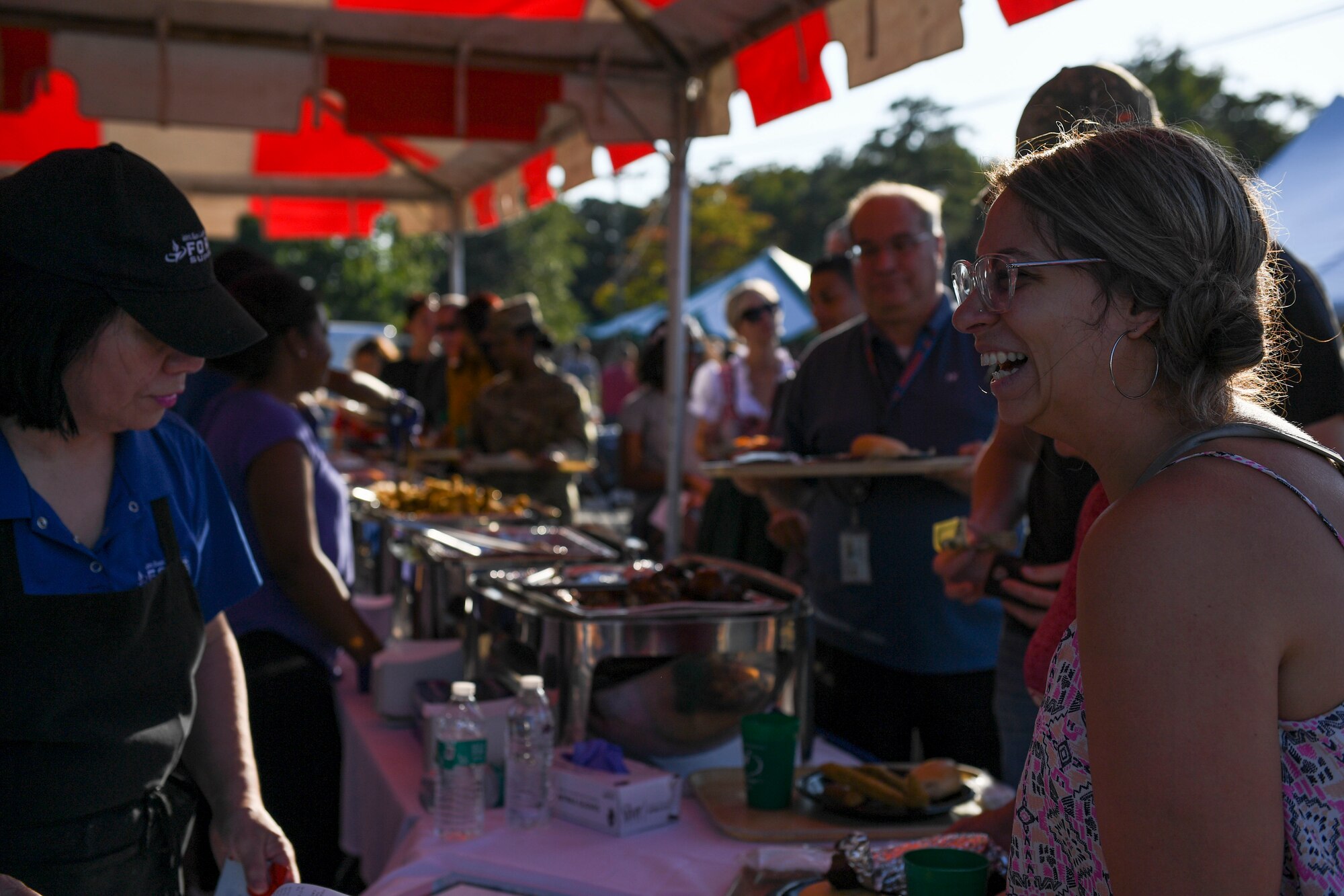 Event attendees line up for food during an Oktoberfest celebration at Joint Base Langley-Eustis, Virginia, Sept. 27, 2019.