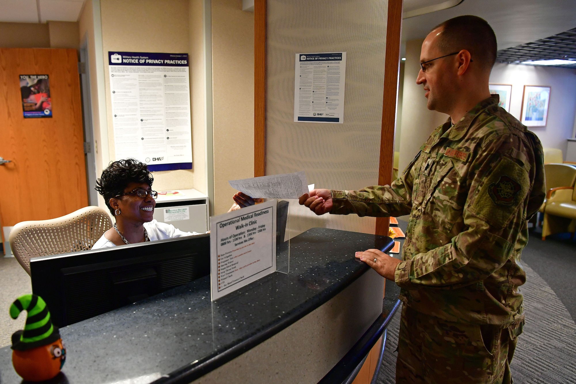 Lt. Col. Micah Schmidt, 19th Medical Group chief of medical staff, demonstrates checking in for an appointment.