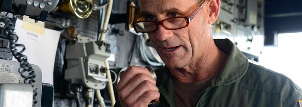 Vice Adm. Andrew Lewis, commander of U.S. 2nd Fleet, speaks to Sailors on the bridge aboard the guided-missile cruiser USS Normandy (CG 60).