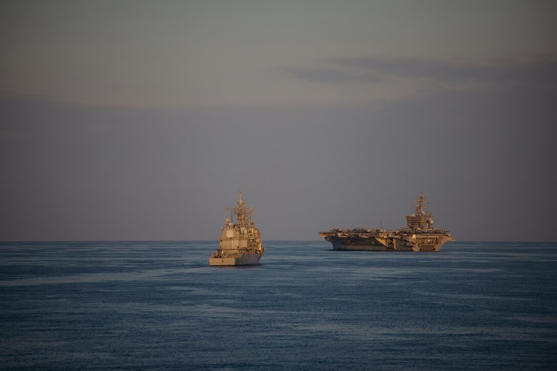 Two military ships take part in an exercise in the Atlantic Ocean.