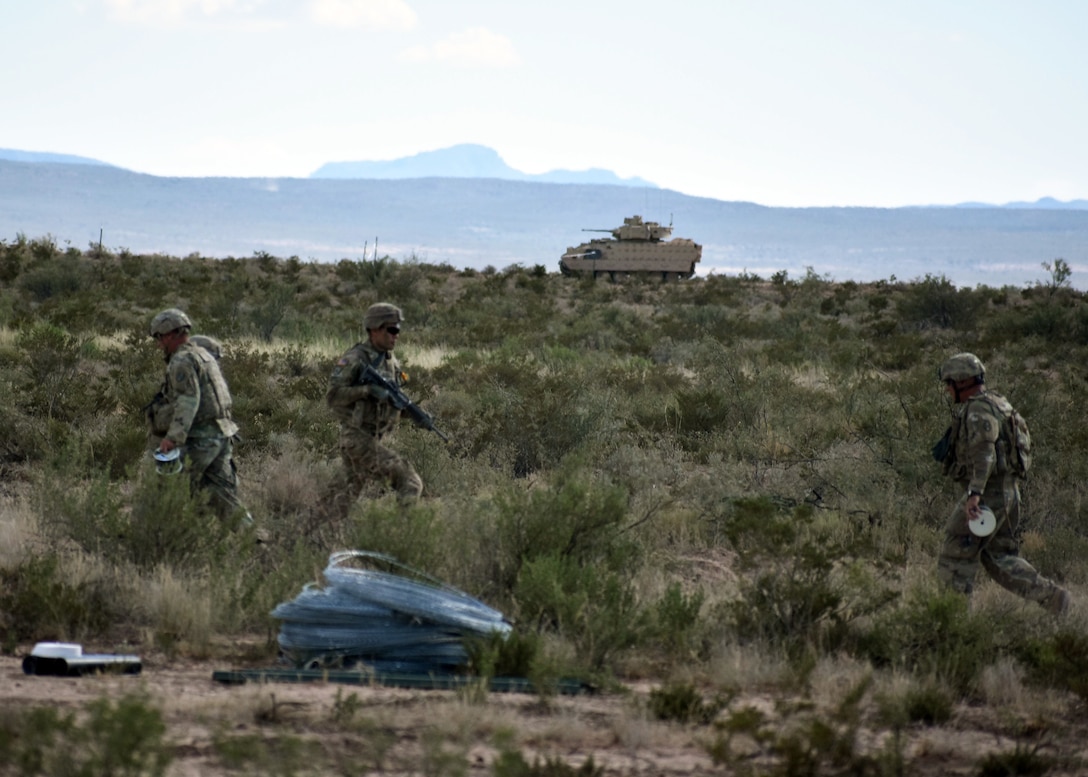 U.S. Combat Engineer Soldiers in Alpha and Bravo Companies, 236th Brigade Engineer Battalion, 30th Armored Brigade Combat Team, North Carolina Army National Guard, conduct engineer qualification table VI, which includes M2 Bradley live fire and breaching an obstacle, on a training range in the vicinity of Fort Bliss, Texas, Sept. 26, 2019.  (U.S. Army National Guard photo by Lt. Col. Cindi King)