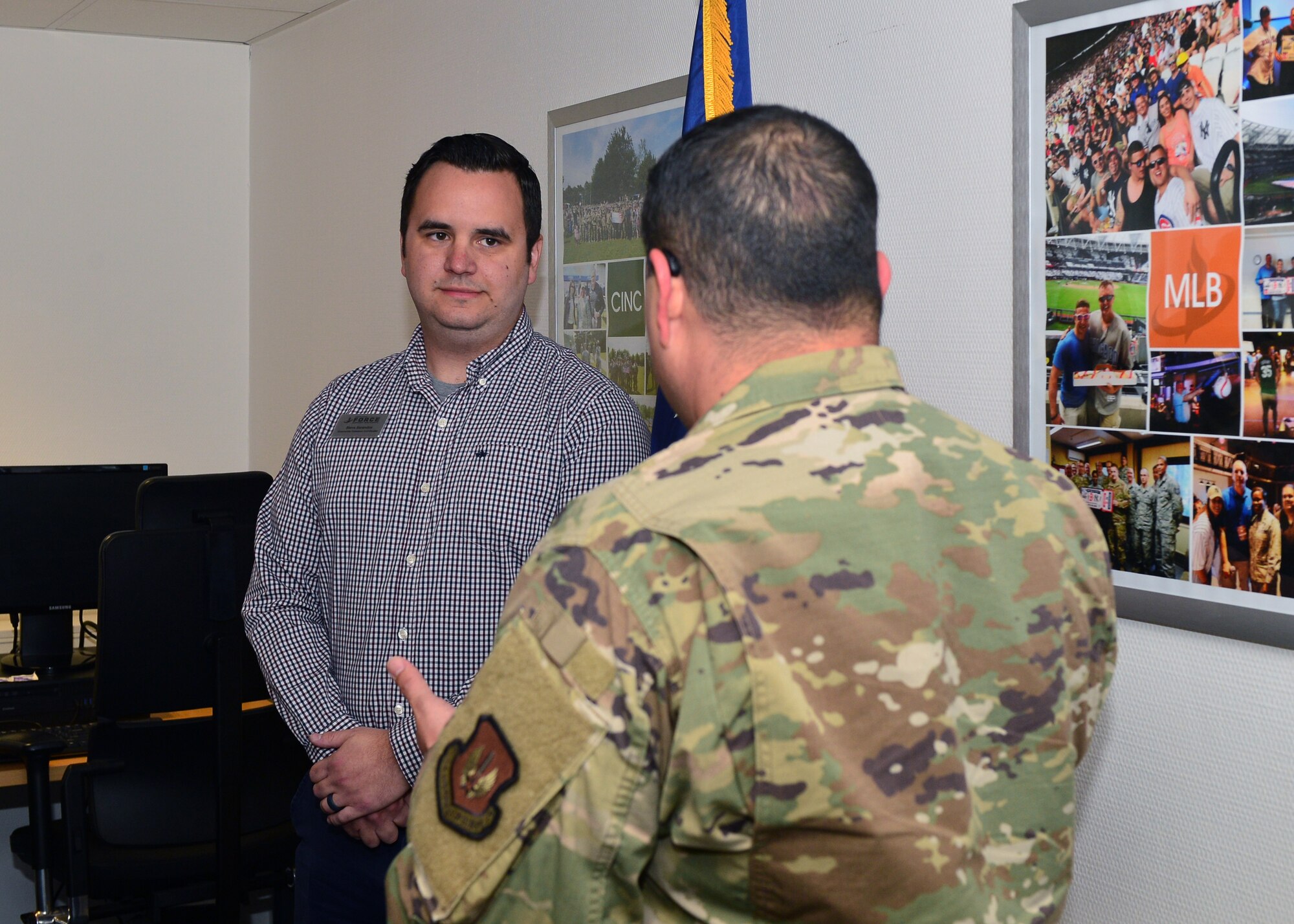 U.S. Air Force Chief Master Sgt. Ernesto J. Rendon, 86th Airlift Wing command chief, recognizes Steven Sarandos, 86th Force Support Squadron community cohesion coordinator, for his efforts in rolling out the Chief of Staff of the Air Force’s Unite program on Ramstein Air Base, Germany, Oct. 2, 2019. The Unite program provides commanders with funding for initiatives to benefit all Airmen. (U.S. Air Force photo by Staff Sgt. Jimmie D. Pike)