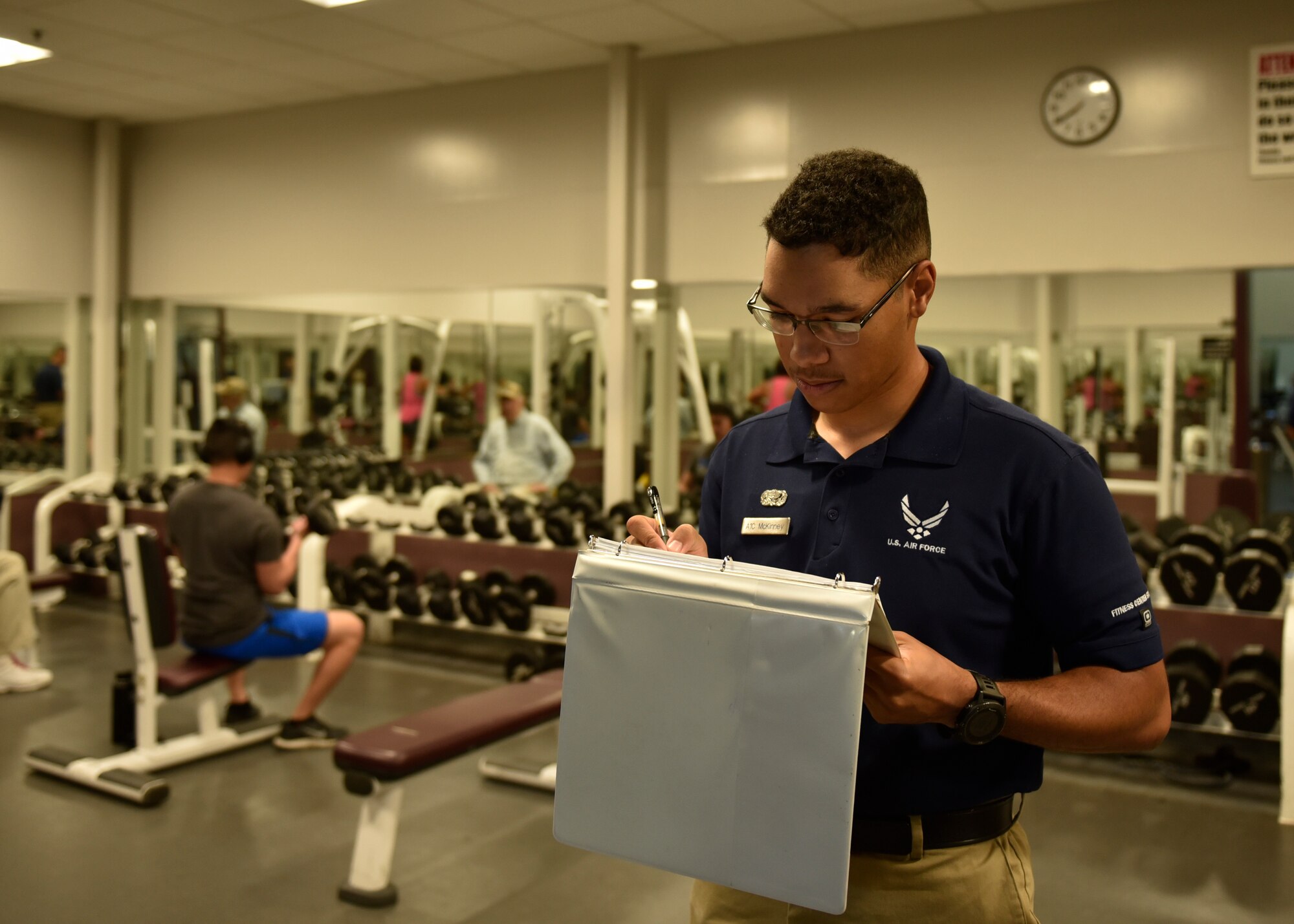 Airman First Class James McKinney, 21st Force Support Squadron fitness specialist, takes a head count of individuals in each room of the gym on Peterson Air Force Base, Colorado, September 25, 2019. Airman McKinney helps to maintain the equipment at Peterson and Cheyenne Mountain Air Force Station. (U.S. Air Force photo by Airman Alexis Christian)