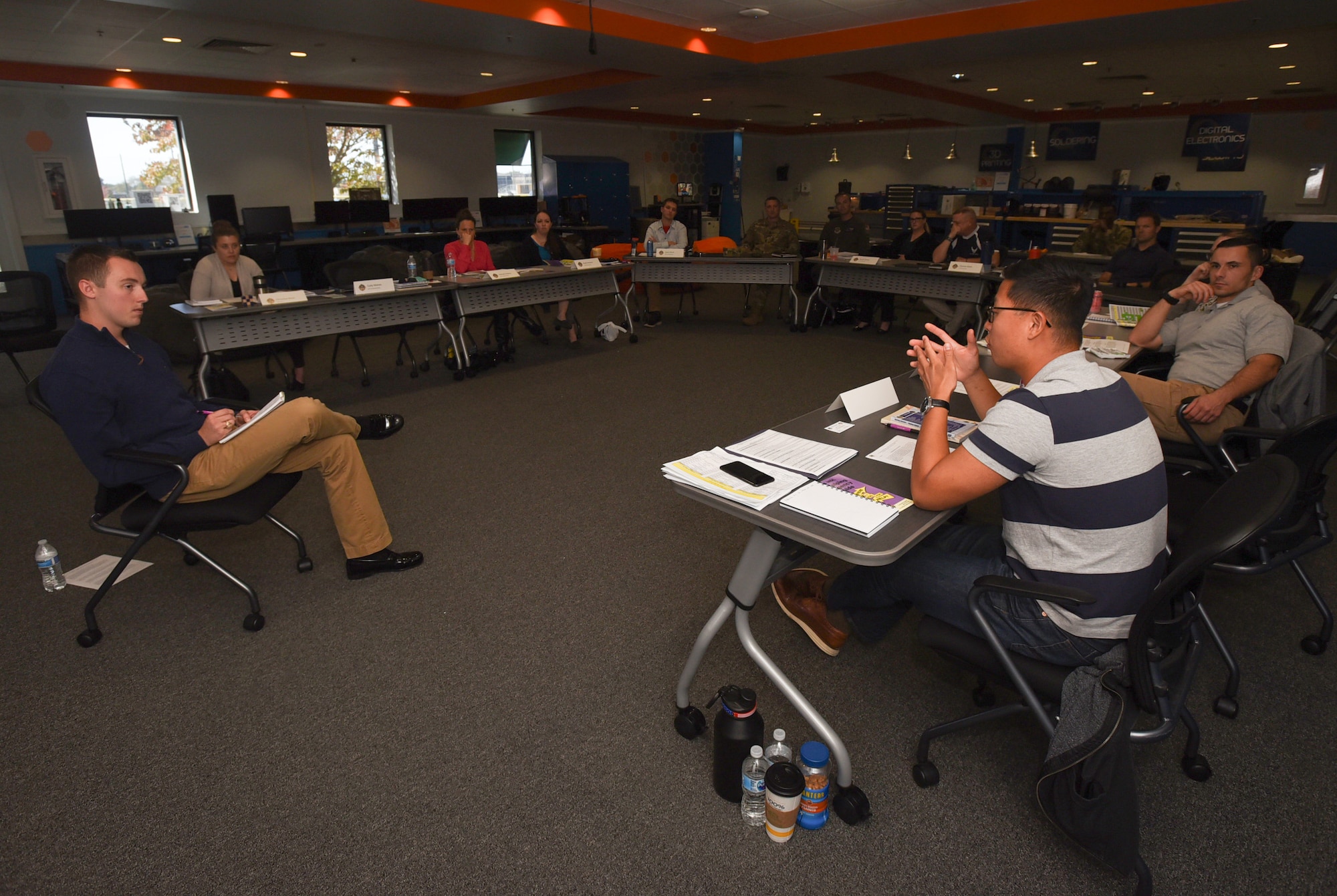 Flight Commander Course students discuss different interpersonal communication techniques to use during a live simulation – mixing reality leadership experience with artificial intelligence on Joint Base McGuire-Dix-Lakehurst, New Jersey, Sept. 27, 2019. The AI implemented gives perspective on how to take care of Airmen and is an effort to restore readiness at the fundamental fighting organization of the United States Air Force – the squadron. (U.S. Air Force photo by Airman 1st Class Ariel Owings)