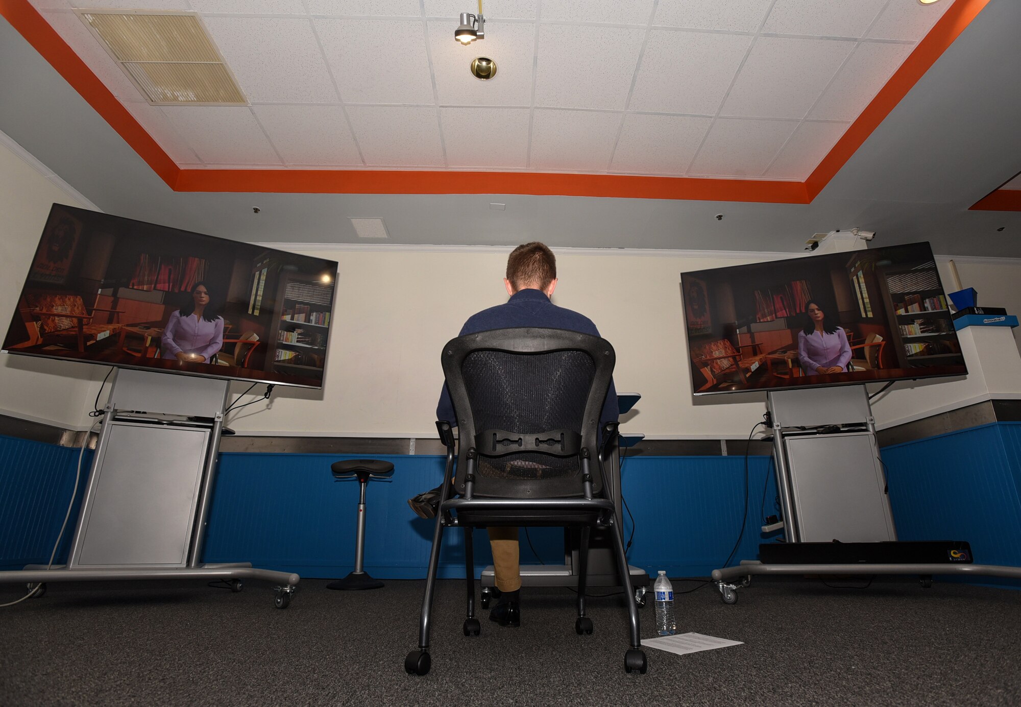 A Flight Commander Course student interacts with artificial intelligence in a live simulation – mixing reality leadership experience during the class capstone event on Joint Base McGuire-Dix-Lakehurst, New Jersey, Sept. 27, 2019. The simulation was conducted for the first time in Air Mobility Command to allow potential leaders to see processes and techniques used by different students on how to handle stressful situations. (U.S. Air Force photo by Airman 1st Class Ariel Owings)