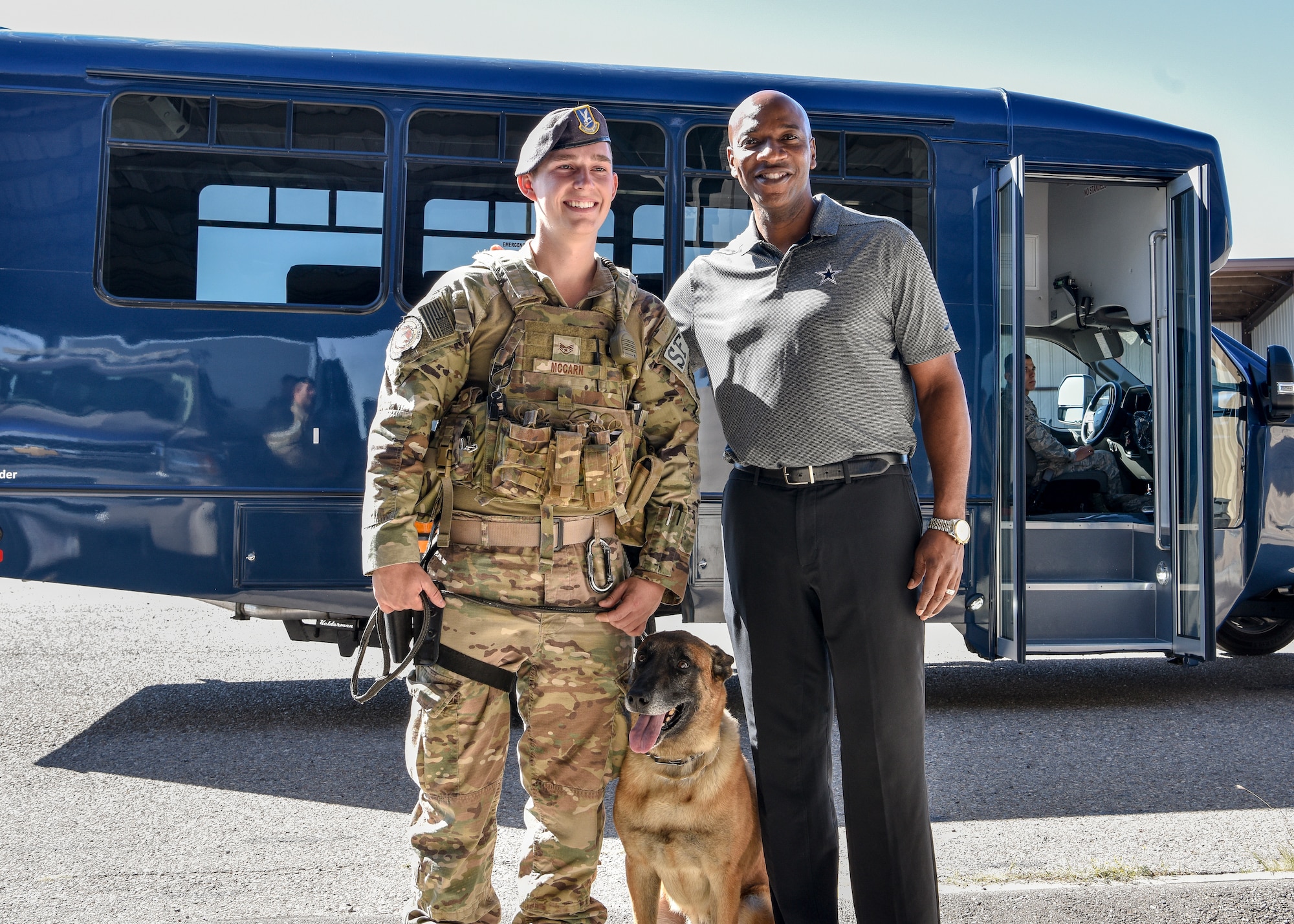 Chief Master Sgt. of the Air Force Kaleth O. Wright poses for a photo with Staff Sgt. Blake McCarn, 377th Security Forces Squadron Military Working Dog handler and Garbo, 377th SFS MWD at Kirtland Air Force Base, N.M., Sept. 28, 2019. Wright spent two days at Kirtland visiting with Airmen, learning their stories and how they contribute to the many missions carried out at Kirtland. (U.S. Air Force photo by Airman 1st Class Austin J. Prisbrey)