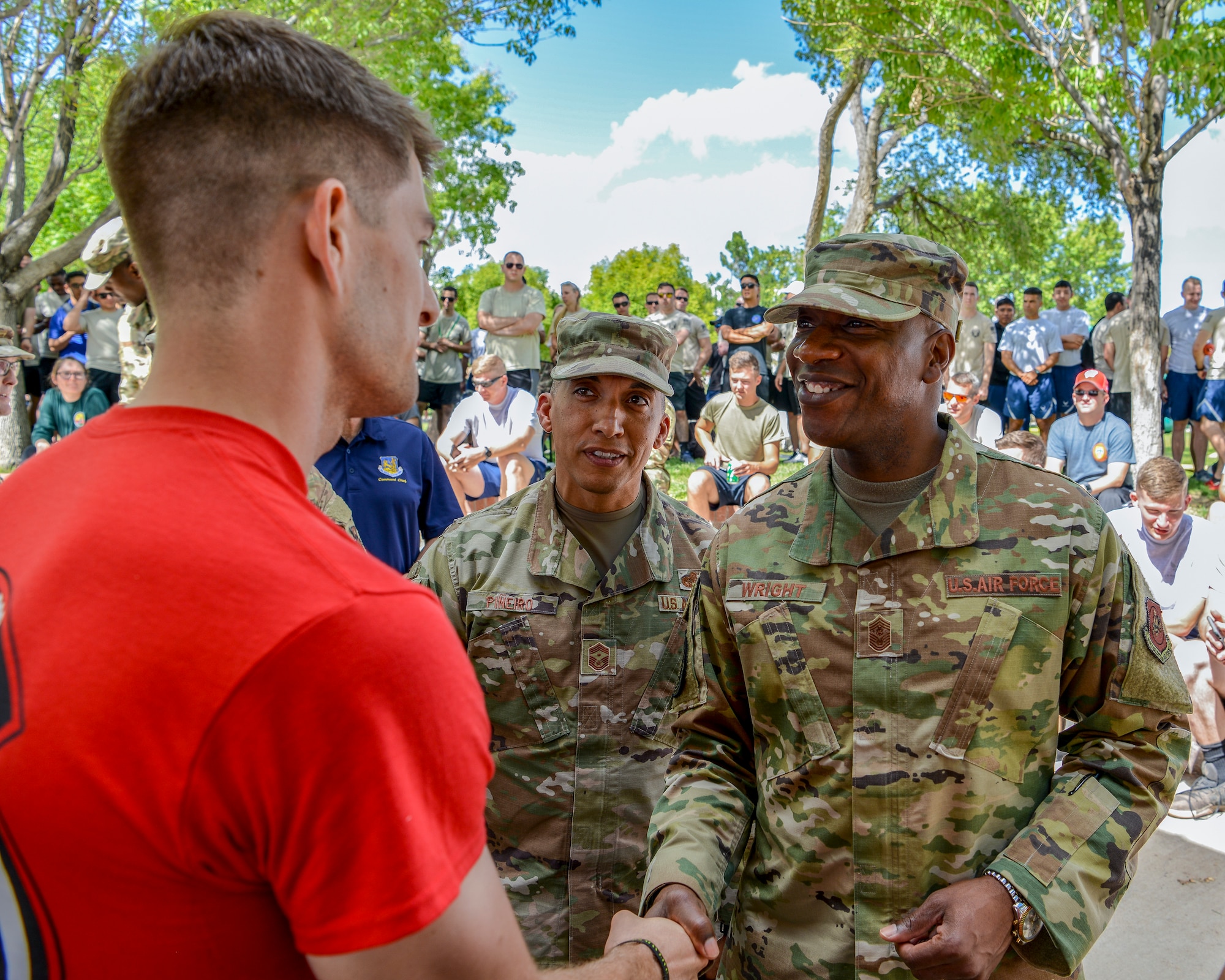 Chief Master Sgt. of the Air Force Kaleth O. Wright (right) coins Senior Airman Isaac Buck, 512th Rescue Squadron HH-60 small unit training monitor, at Kirtland Air Force Base, N.M., Sept. 27, 2019. Wright recognized Airmen belonging to Team Kirtland that performed above and beyond their own call of duty with his challenge coin. (U.S. Air Force photo by Airman 1st Class Austin J. Prisbrey)