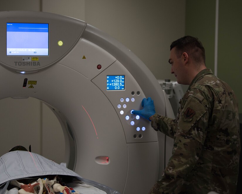 U.S. Air Force Senior Airman Marcus Cockrum, 633rd Surgical Operations Squadron diagnostic medical stenographer, preps the CT machine during radiology trauma training on Joint Base Langley-Eustis, Virginia, Sept. 26, 2019. Cockrum took the lead in organizing his squadron’s training to help better prepare them for real world events. (U.S. Air Force photo by Airman 1st Class Marcus M. Bullock)