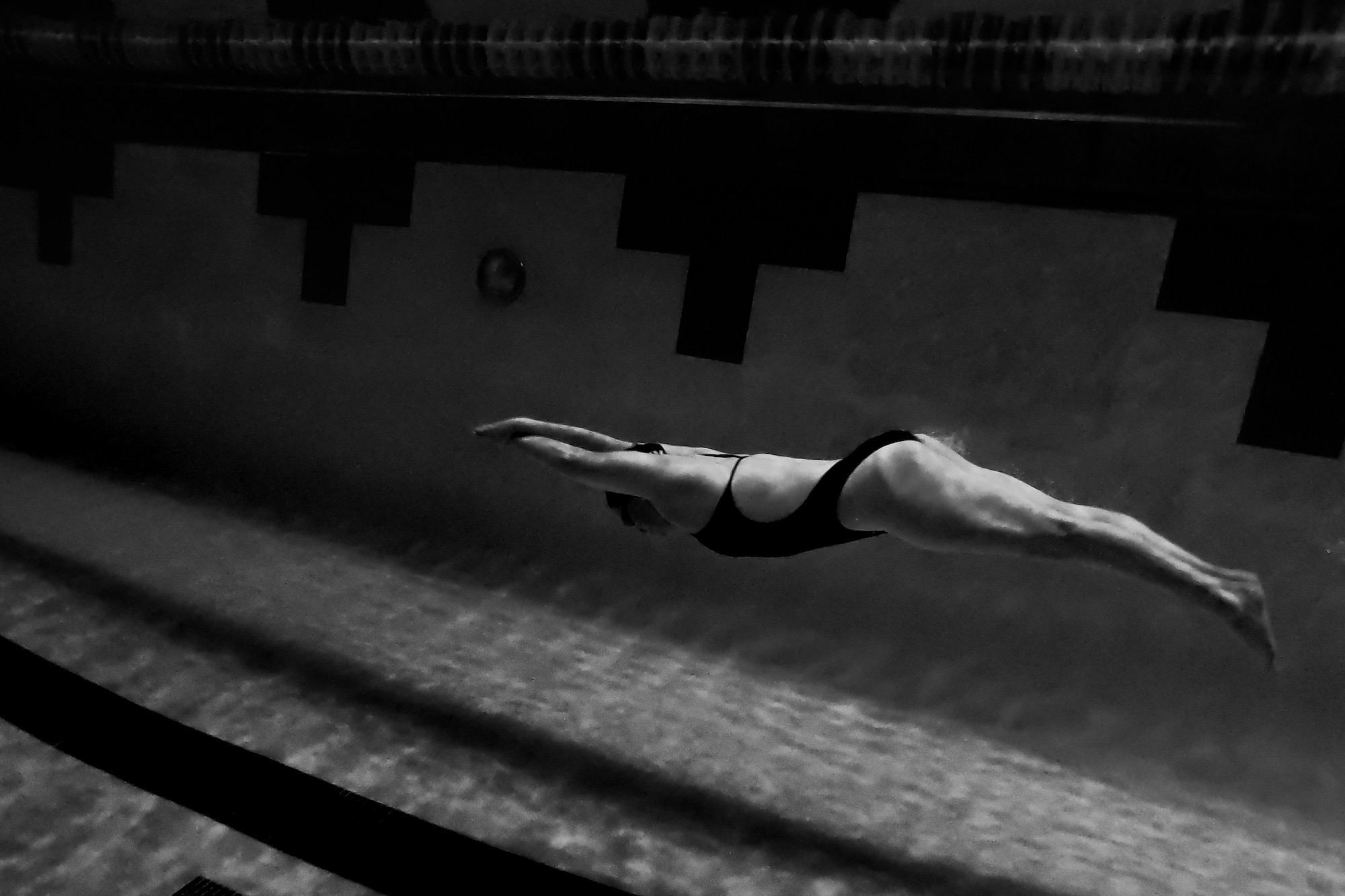 U.S. Air Force 1st Lt. Genevieve Miller, 17th Intelligence Squadron deputy flight commander, dives underwater during practice at Joint Base Langley-Eustis, Virginia, Sept. 19, 2019.