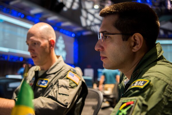 (From Left) U.S. Air Force Lt. Col. Galen Ojala, U.S. Southern Command Director of Space Forces, works with Brazilian Air Force Maj. Rafael de Almeida Duque, Brazilian Aerospace Command, at Lockheed Martin’s Center for Innovation in Suffolk, Va., Sept. 27, 2019, during Global Sentinel 19. The event provided an opportunity to develop and implement processes for partners from Australia, Canada, France, Germany, Italy, Japan, the Republic of Korea, Spain, the United Kingdom, the United States to collaborate on space surveillance and spaceflight safety to broaden mutual understanding and enhance cooperation.  (U.S. Air Force photo by Staff Sgt. J.T. Armstrong)