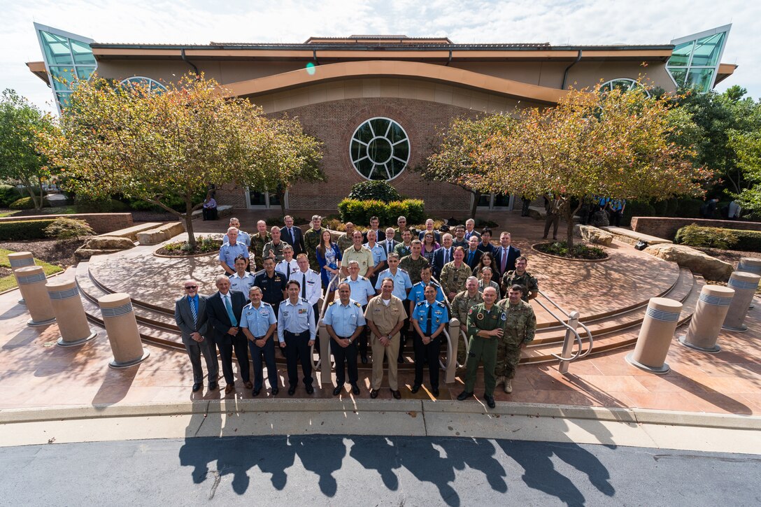 Military partners from around the world pose for a portrait infront of Lockheed Martin’s Center for Innovation in Suffolk, Va., Sept. 27, 2019, during Global Sentinel 19. U.S. Space Command led the sixth international space experiment, GS 19, Sept. 23-27. (U.S. Air Force photo by Staff Sgt. J.T. Armstrong)