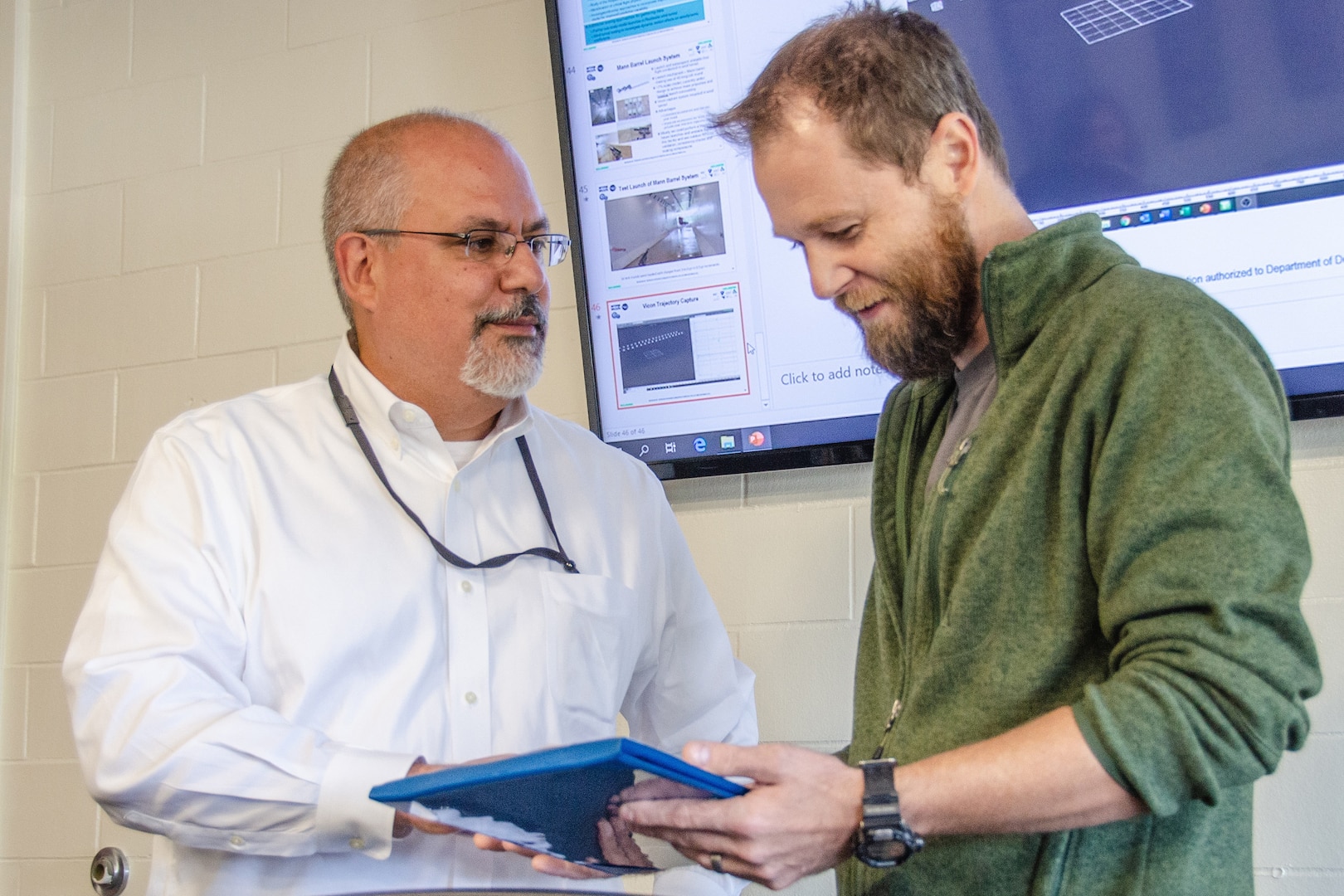 IMAGE: Patrick Browning, assistant professor of mechanical and aerospace engineering at West Virginia University, right, receives research award from John Fiore, Technical Director of the Naval Surface Warfare Center Dahlgren Division of the United States Navy.