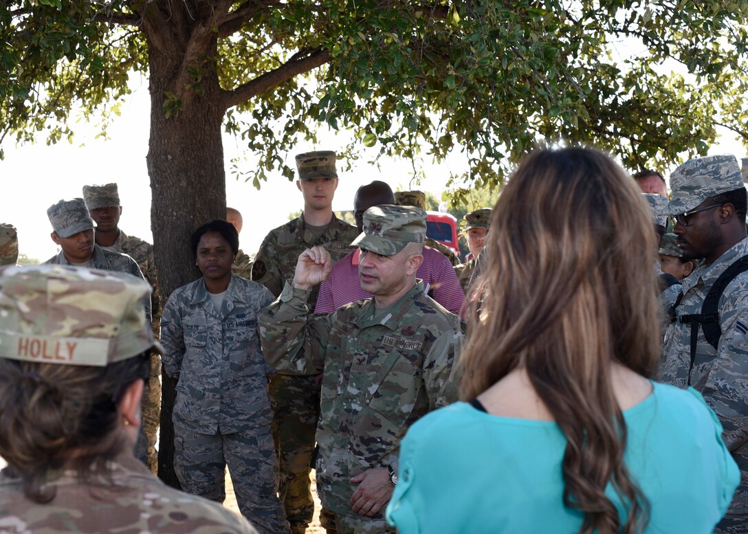 U.S. Air Force Col. Andres Nazario, 17th Training Wing commander, engages with individuals after a test fire drill at the Norma Brown building on Goodfellow Air Force Base, Texas, Oct. 2, 2019. The drill was to see how prepared members were before going into Fire Prevention Week, which is the second week of October. (U.S. Air Force photo by Airman 1st Class Zachary Chapman/Released)