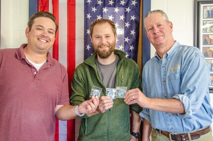 IMAGE: Patrick Browning, assistant professor of mechanical and aerospace engineering at West Virginia University received a research award from the U.S. Navy, Oct. 1. Left to Right: Chris Griffin, Patrick Browning,  Wade Huebsch.