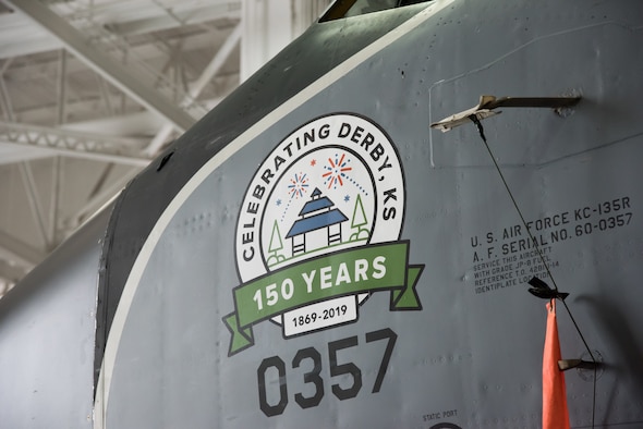 Nose art dedicated to the city of Derby's 150th anniversary is displayed on a KC-135 Stratotanker Oct. 2, 2019, at McConnell Air Force Base, Kan. American pilots painting the nose of an aircraft dates back to World War I and was used as a way to identify flying squadrons and boost morale. (U.S. Air Force photo by Senior Airman Skyler Combs)