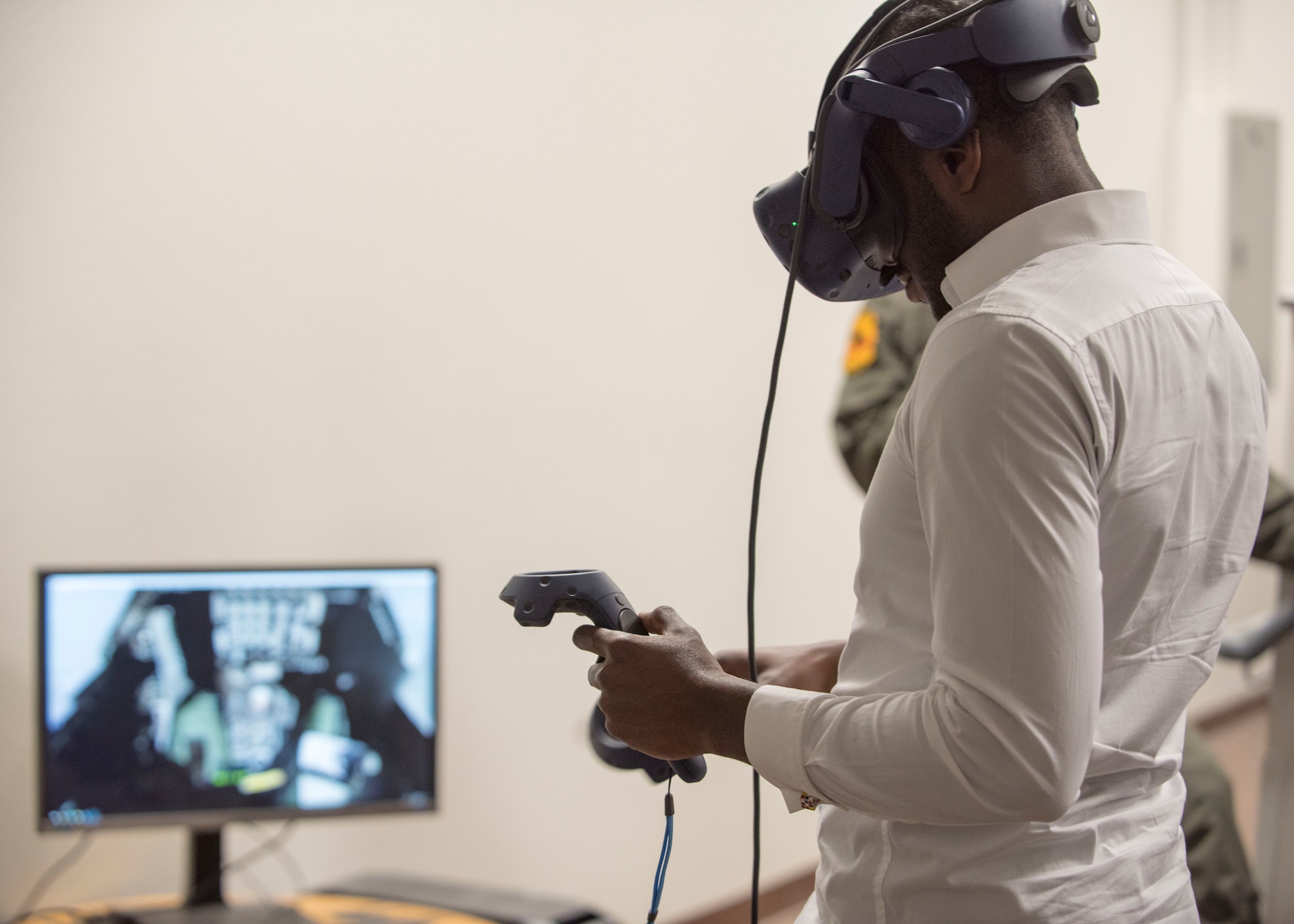 Yves Zamar, congressional staff representative for Congresswoman Deb Haaland, tries out virtual reality equipment, Oct. 2, 2019, on Holloman Air Force Base, N.M. The 8th Fighter Squadron is in the process of implementing VR into their training environment. (U.S. Air Force photo by Staff Sgt. Christine Groening)